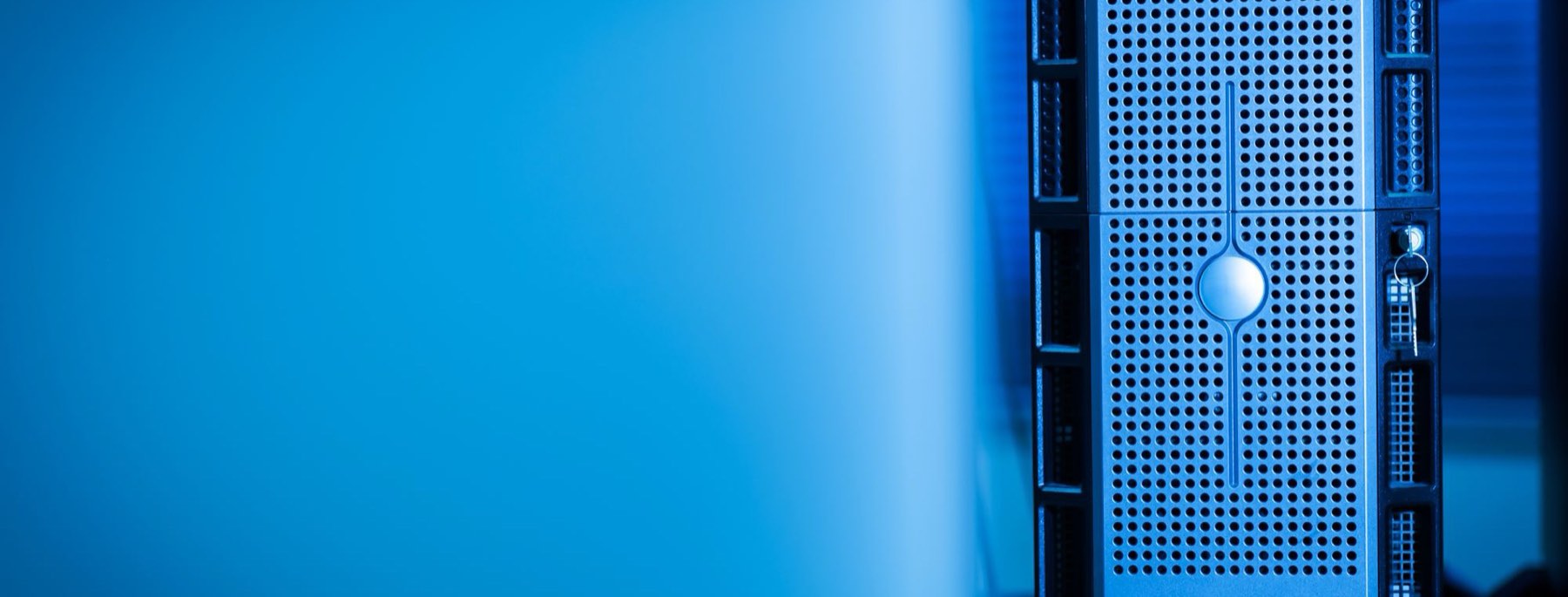Server hardware in a blue lit equipment room