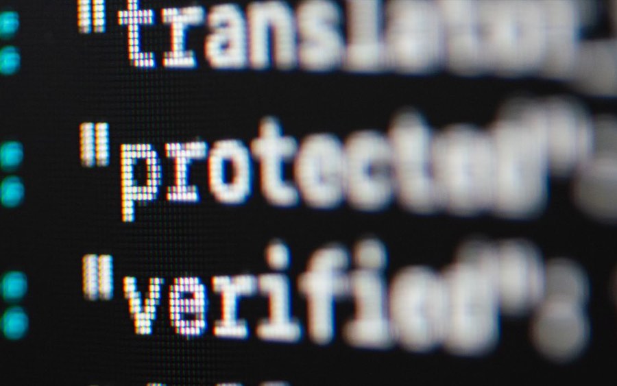 Extreme close-up of program code rendered on a screen
